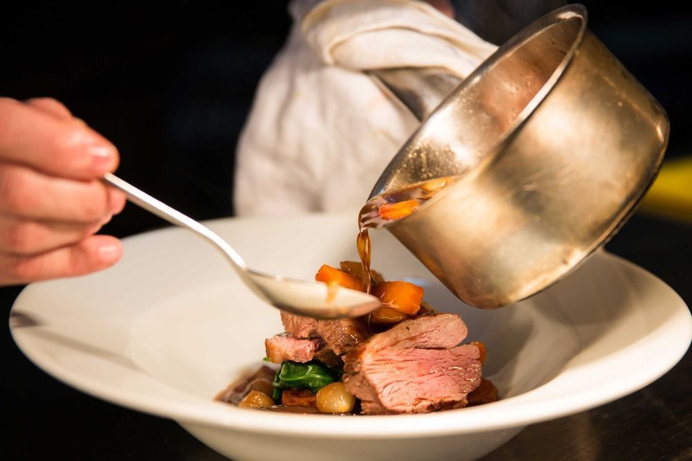 The Millstone, Mellor 호텔 블랙번 외부 사진 A chef plating a dish